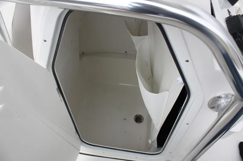 Slide: The Image of 2025 Key West 203 FS boat storage compartment with drain. - 16