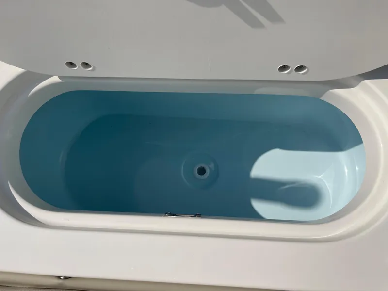 Slide: The Image of Open storage compartment on 2025 Key West 203 FS boat. - 26