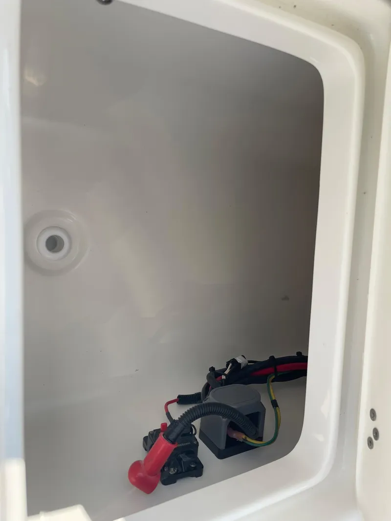Slide: The Image of 2025 Key West 203 FS boat storage compartment with wiring. - 28