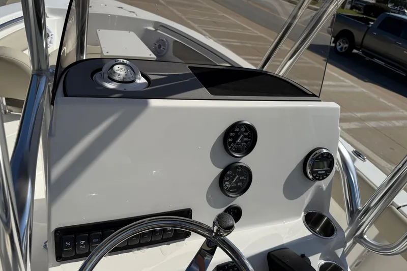 Slide: The Image of 2026 Key West 203 FS boat dashboard with gauges and steering wheel. - 30