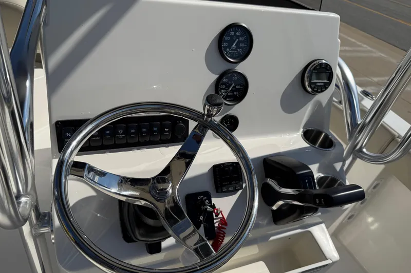 Slide: The Image of Steering console of 2026 Key West 203 FS boat with gauges and controls. - 33