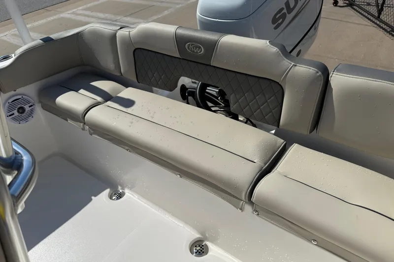 Slide: The Image of 2026 Key West 203 FS boat interior with cushioned seating and speaker. - 36