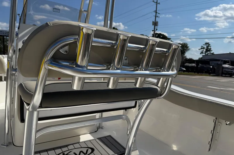 Slide: The Image of 2026 Key West 203 FS boat interior with rod holders and seating, under a clear sky. - 39