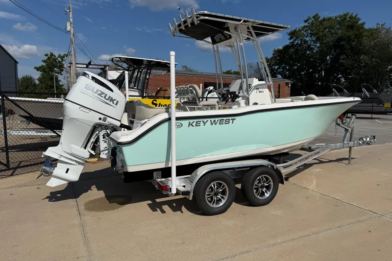 Slide: The Image of 2026 Key West 203 FS boat on trailer with Suzuki outboard motor. - 6