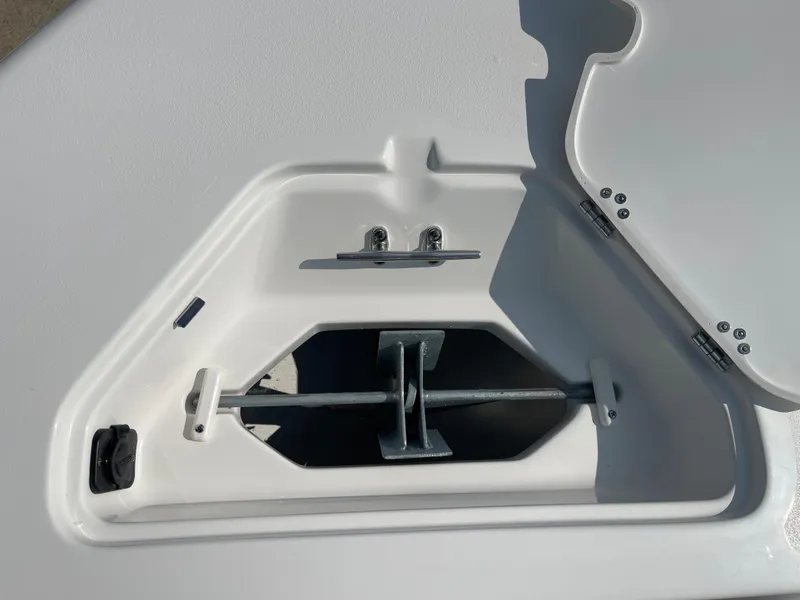 Slide: The Image of Key West 203 FS 2025 boat anchor compartment with open hatch. - 8