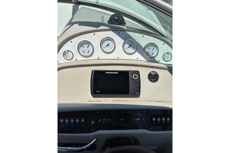 Slide: The Image of Dashboard of 2005 Chaparral 290 Signature boat with gauges and navigation system. - 11