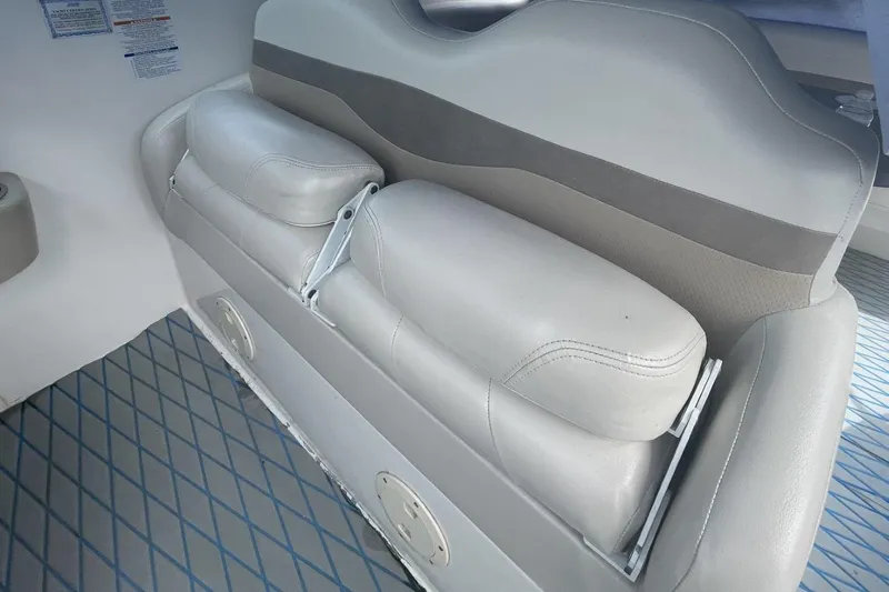 Slide: The Image of 2005 Chaparral 290 Signature boat interior seating with gray upholstery. - 12