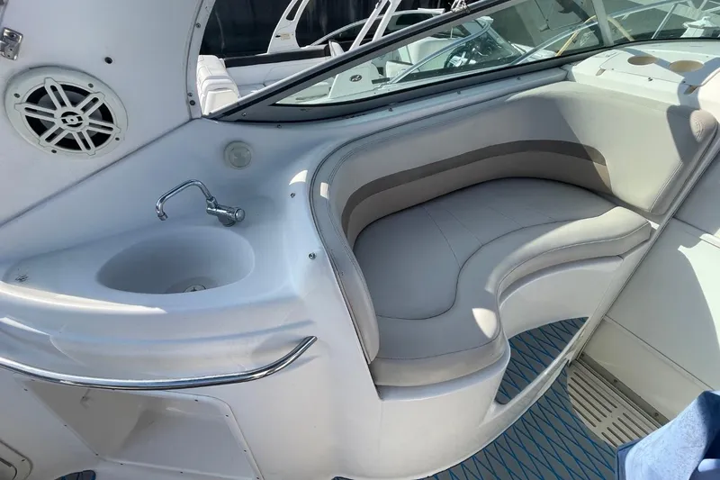 Slide: The Image of 2005 Chaparral 290 Signature boat interior with seating and sink. - 14