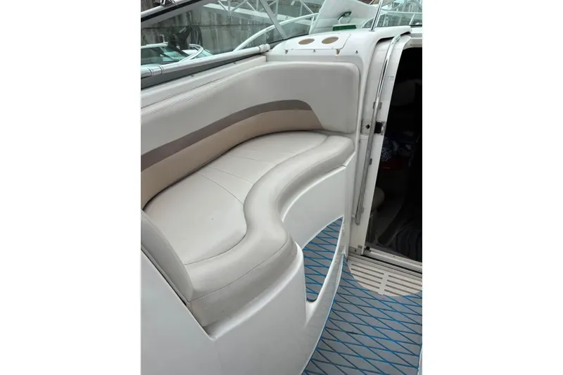 Slide: The Image of 2005 Chaparral 290 Signature boat interior with curved seating and modern design. - 15