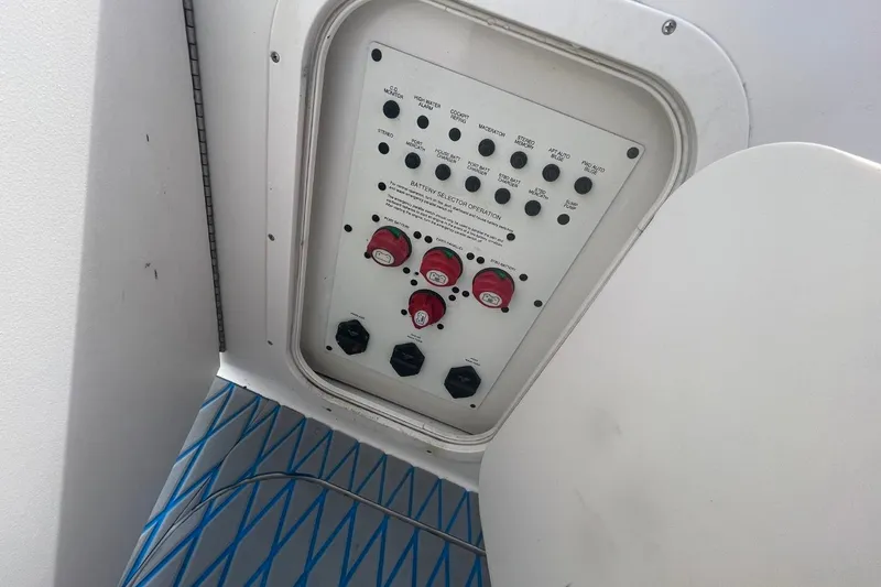 Slide: The Image of Control panel of a 2005 Chaparral 290 Signature boat, featuring switches and dials. - 18