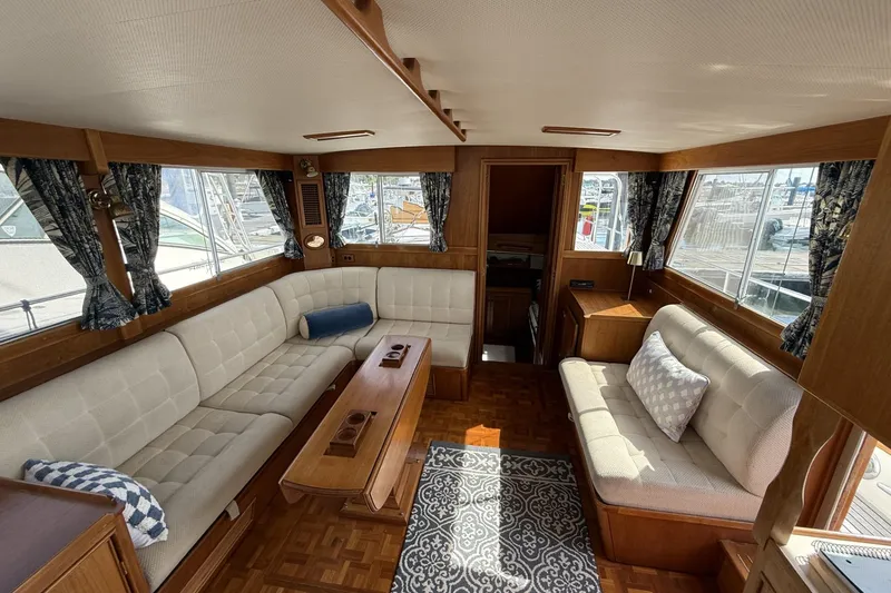 Slide: The Image of Interior of 1999 Grand Banks 42 Classic yacht with elegant seating and wooden accents. - 29