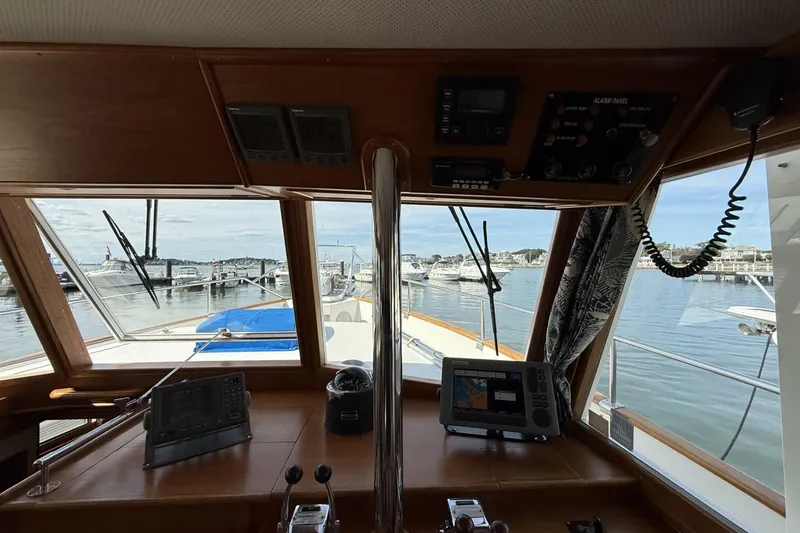 Slide: The Image of Interior view of 1999 Grand Banks 42 Classic yacht helm with navigation equipment. - 44