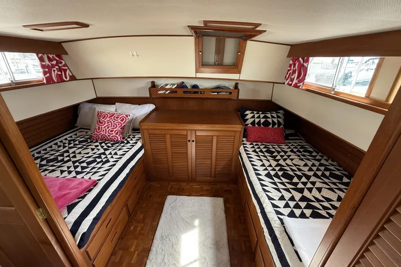 Slide: The Image of Cabin interior of 1999 Grand Banks 42 Classic with twin beds and nautical decor. - 46