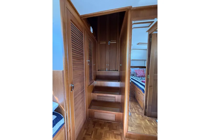 Slide: The Image of Interior of 1999 Grand Banks 42 Classic yacht with wooden stairs and cabinetry. - 49