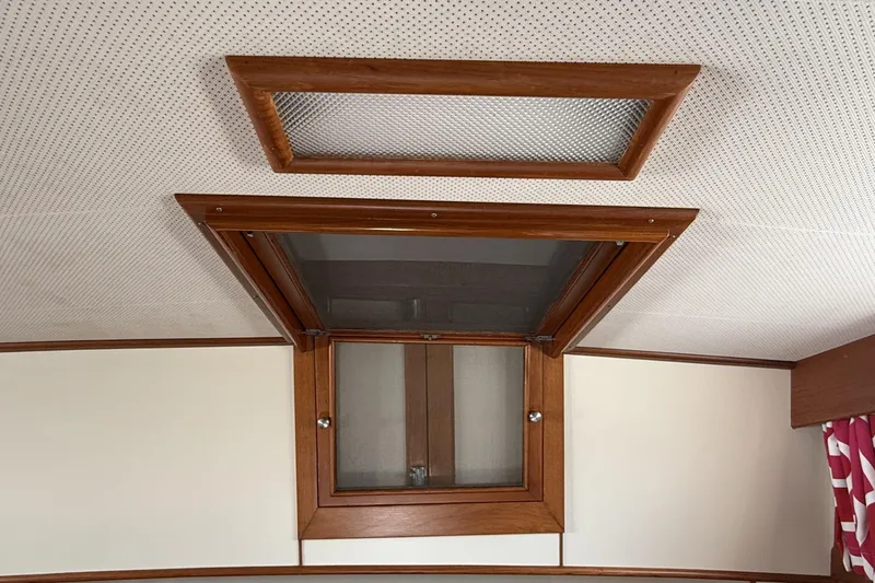 Slide: The Image of Ceiling hatch of 1999 Grand Banks 42 Classic yacht with wooden frame and screen. - 50
