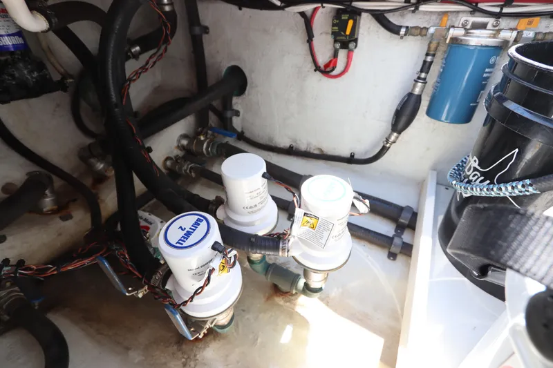 Slide: The Image of Engine compartment of 2013 Yellowfin 32 Offshore boat with filters and wiring. - 13