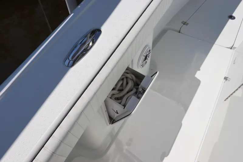 Slide: The Image of 2013 Yellowfin 32 Offshore boat deck with rope storage and speaker detail. - 17