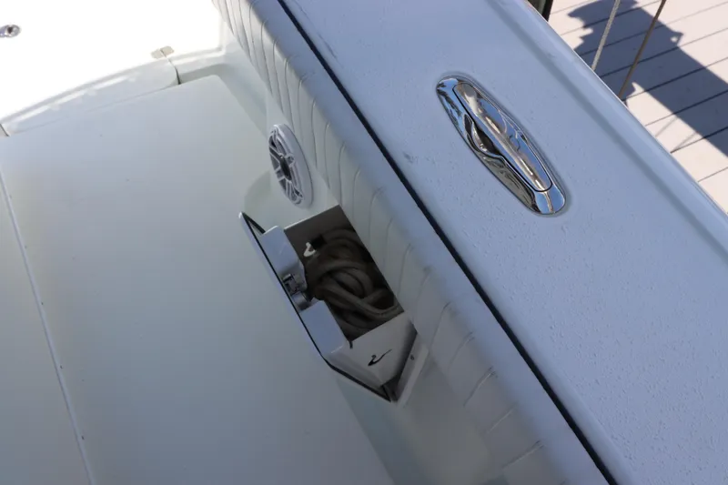 Slide: The Image of 2013 Yellowfin 32 Offshore boat deck with storage compartment and cleat. - 19