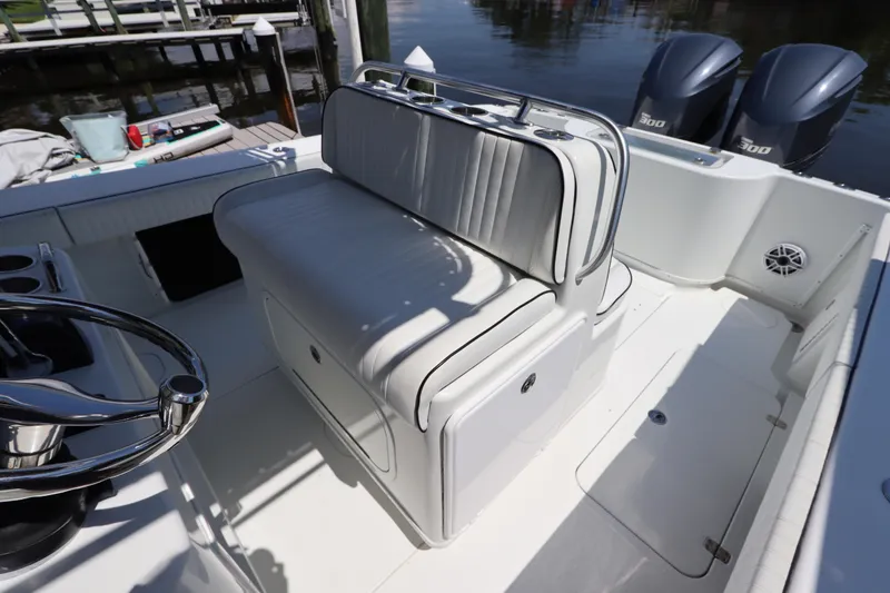 Slide: The Image of 2013 Yellowfin 32 Offshore boat interior with seating and dual engines. - 23