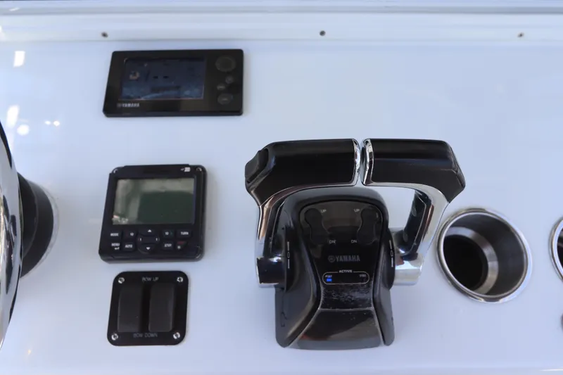 Slide: The Image of Control panel of 2013 Yellowfin 32 Offshore boat with Yamaha throttle and displays. - 32