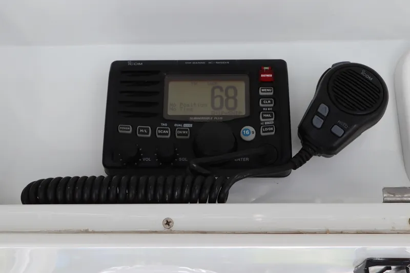 Slide: The Image of VHF marine radio on 2013 Yellowfin 32 Offshore boat dashboard. - 36