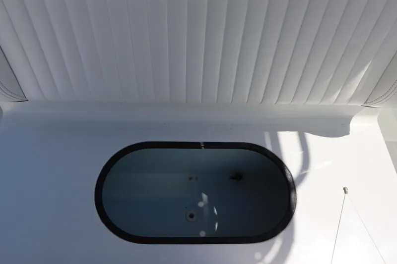 Slide: The Image of 2013 Yellowfin 32 Offshore boat interior with open storage compartment. - 43