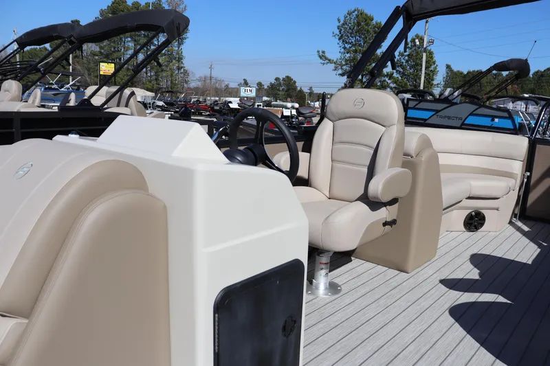 Slide: The Image of 2025 Flagship Endurance 22 CU Tritoon interior with beige seating and steering wheel. - 5