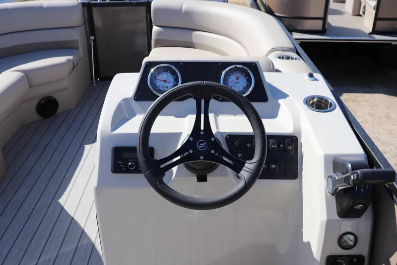 Slide: The Image of Steering console of 2025 Flagship Endurance 22 CU Tritoon with gauges and controls. - 6