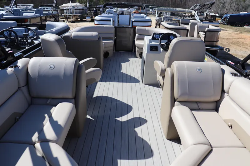 Slide: The Image of 2025 Flagship Endurance 22 CU Tritoon with luxurious seating and modern dashboard. - 9