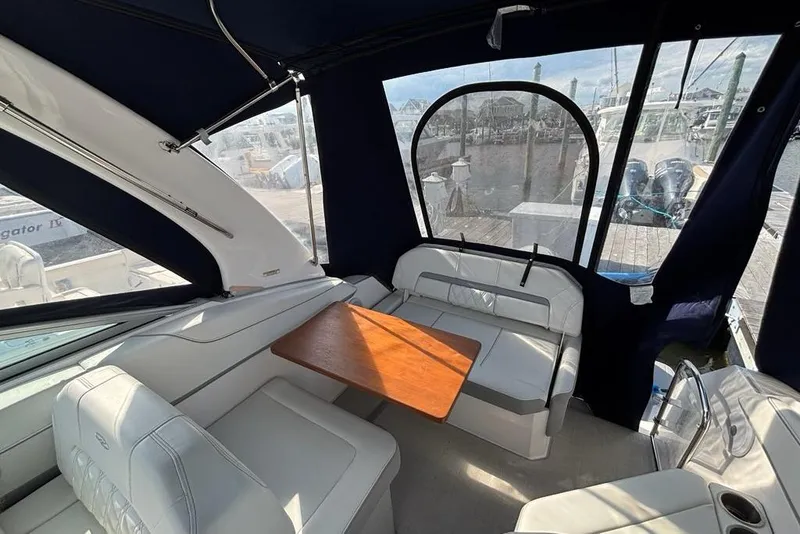 Slide: The Image of Interior of 2023 Regal 26 XO boat with seating and wooden table. - 9