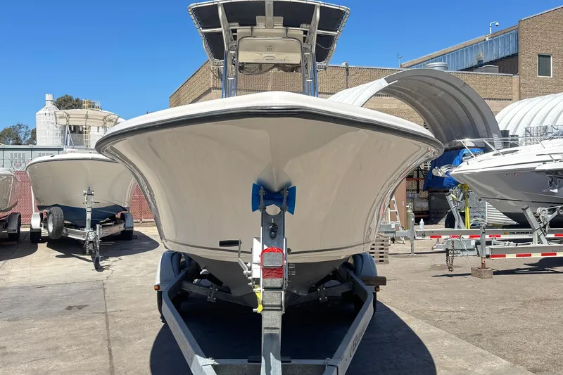 Slide: The Image of 2019 Key West 239 FS boat on trailer in industrial setting. - 3