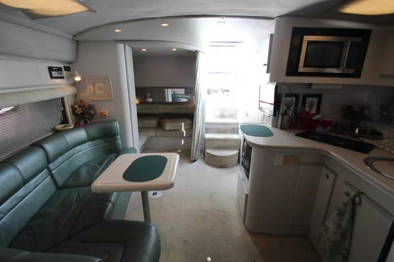 Slide: The Image of Interior of 1994 Cruisers Yachts Esprit 3775 with kitchen and seating area. - 17