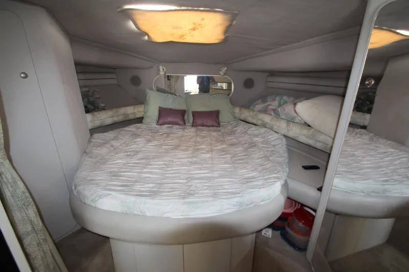 Slide: The Image of 1994 Cruisers Yachts Esprit 3775 cabin interior with cozy bed and mirrored wall. - 21