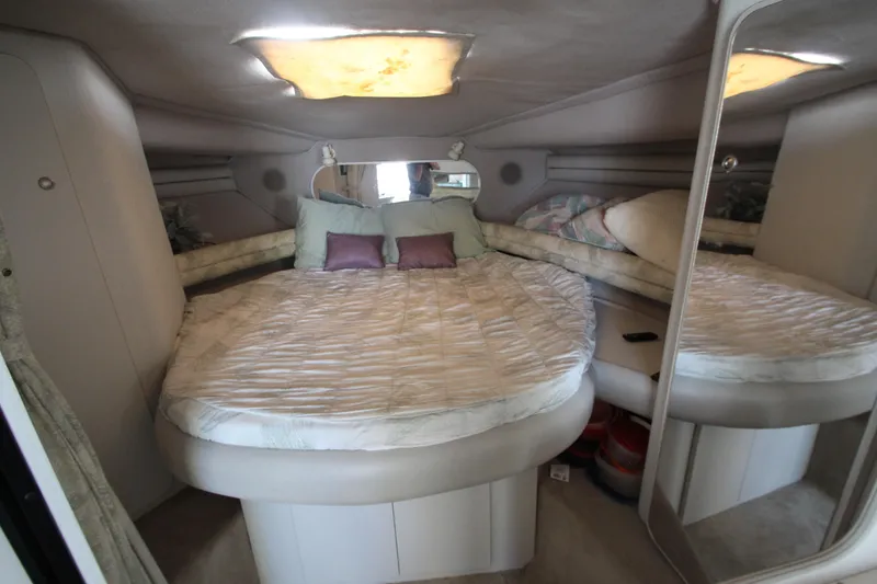 Slide: The Image of 1994 Cruisers Yachts Esprit 3775 cabin interior with cozy bed and mirrored wall. - 22