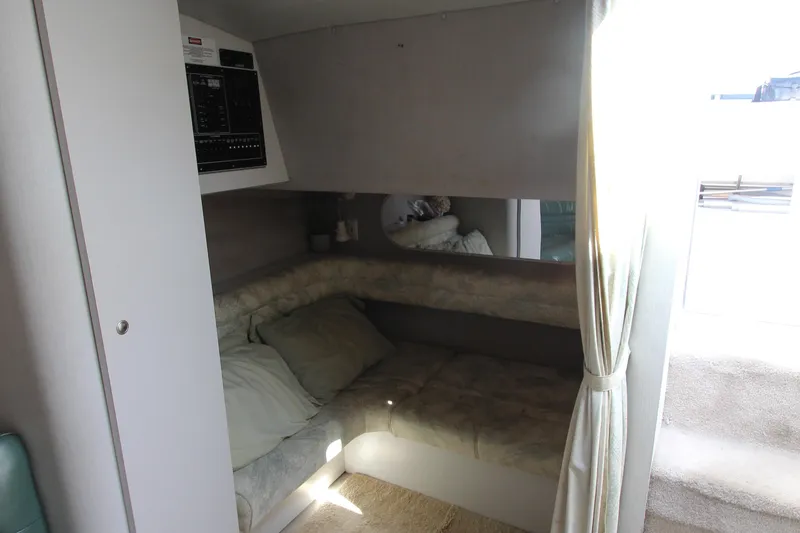 Slide: The Image of 1994 Cruisers Yachts Esprit 3775 interior cabin with cozy seating and control panel. - 25