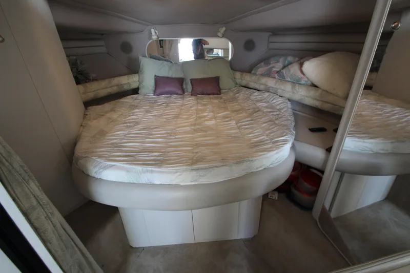 Slide: The Image of 1994 Cruisers Yachts Esprit 3775 cabin interior with cozy bed and pillows. - 26