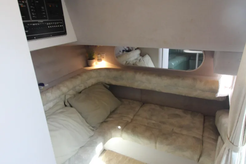 Slide: The Image of Cozy interior cabin of 1994 Cruisers Yachts Esprit 3775 with plush seating and soft lighting. - 29