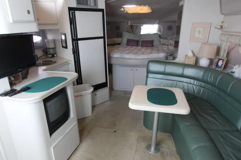 Slide: The Image of Interior of 1994 Cruisers Yachts Esprit 3775 with cozy seating, kitchenette, and bed. - 33