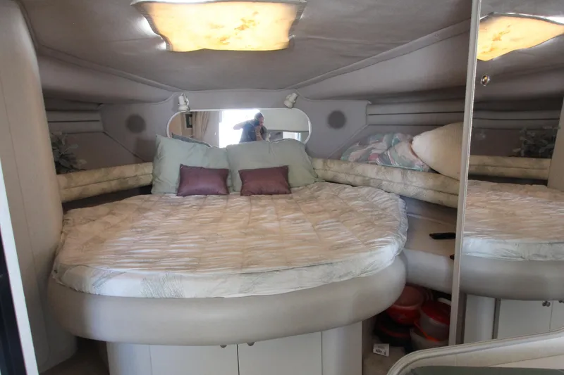 Slide: The Image of 1994 Cruisers Yachts Esprit 3775 interior cabin with cozy bed and pillows. - 23