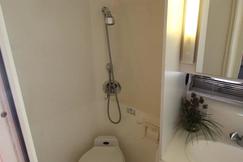 Slide: The Image of 1994 Cruisers Yachts Esprit 3775 bathroom with shower, toilet, and sink. - 34