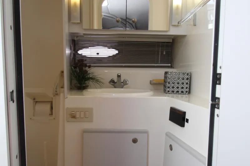 Slide: The Image of Bathroom interior of 1994 Cruisers Yachts Esprit 3775 with sink, mirror, and decor. - 35