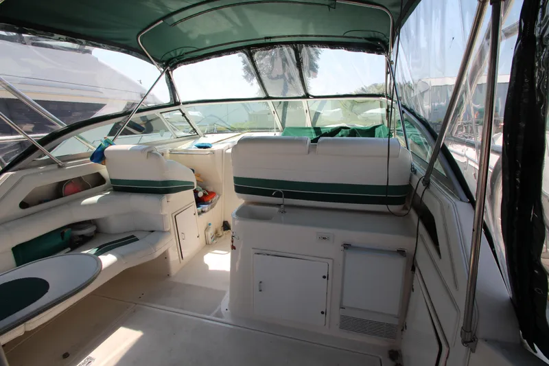 Slide: The Image of 1994 Cruisers Yachts Esprit 3775 interior with seating, canopy, and helm station. - 8