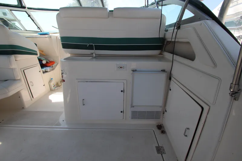 Slide: The Image of 1994 Cruisers Yachts Esprit 3775 interior with seating and storage compartments. - 9