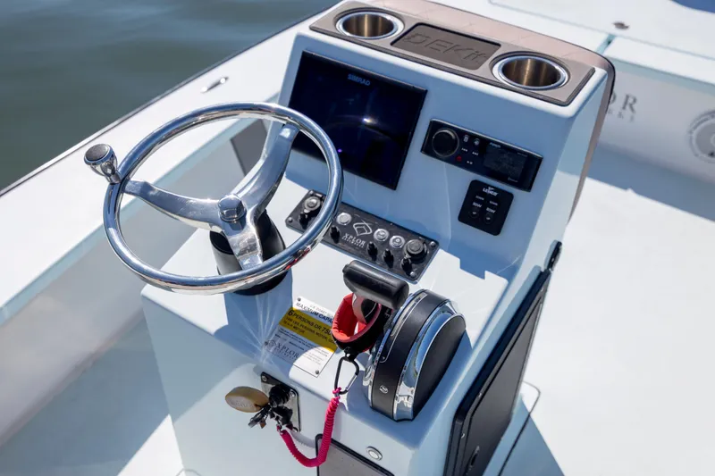 Slide: The Image of Steering console of 2018 Xplor X18 boat with controls and display. - 14