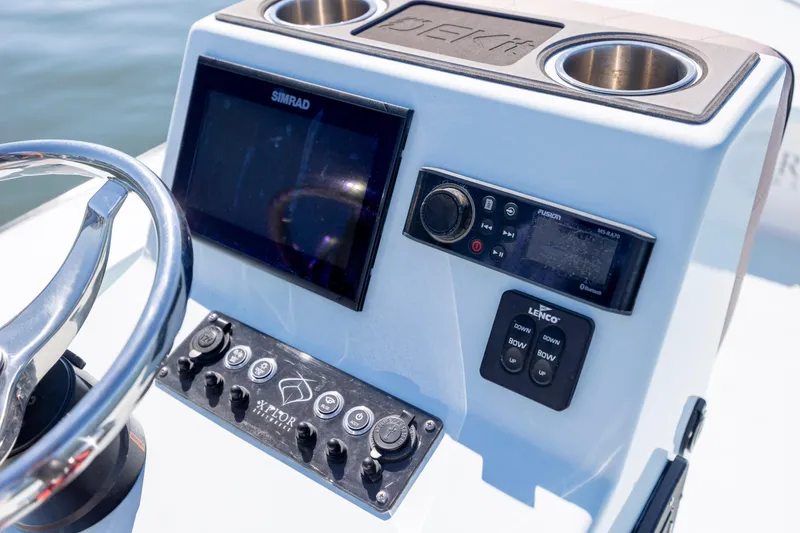 Slide: The Image of Control panel of 2018 Xplor X18 boat with steering wheel and electronic displays. - 15