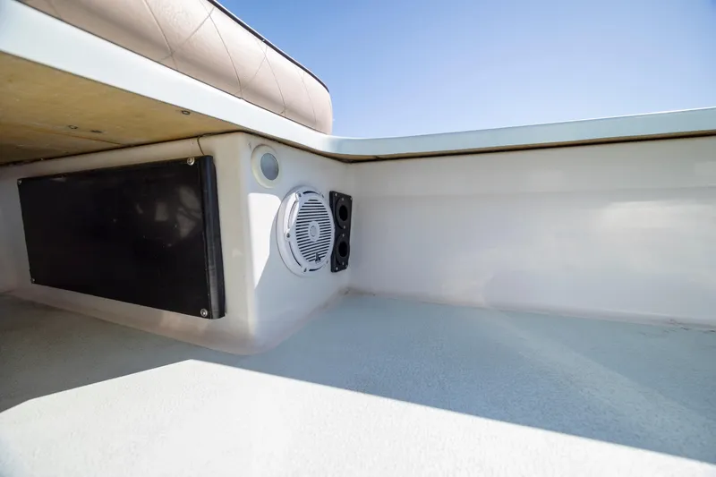 Slide: The Image of Interior view of 2018 Xplor X18 boat with speaker and storage compartment. - 19
