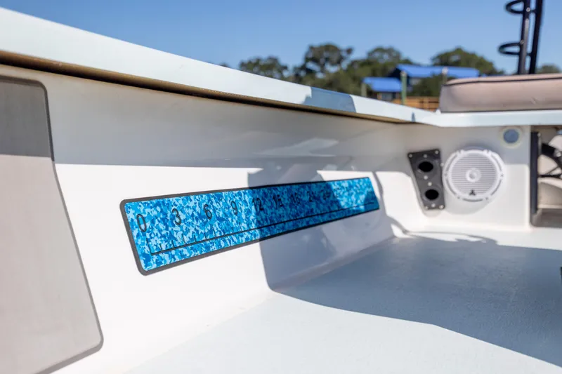 Slide: The Image of Interior of 2018 Xplor X18 boat with blue measurement scale and speaker. - 22