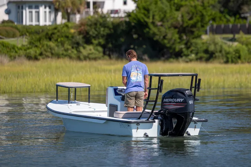 Slide: The Image of Man on 2018 Xplor X18 boat with Mercury engine in calm waters. - 3