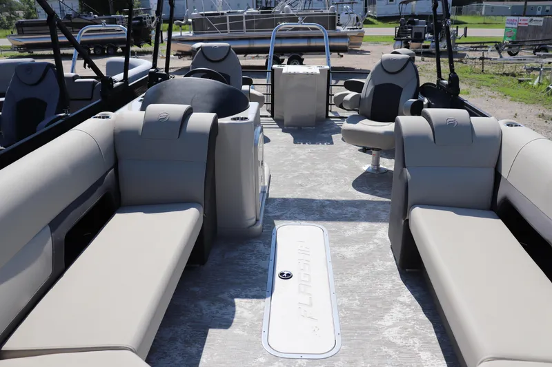 Slide: The Image of 2025 Flagship Discover 22 RF pontoon boat interior with spacious seating and modern design. - 1