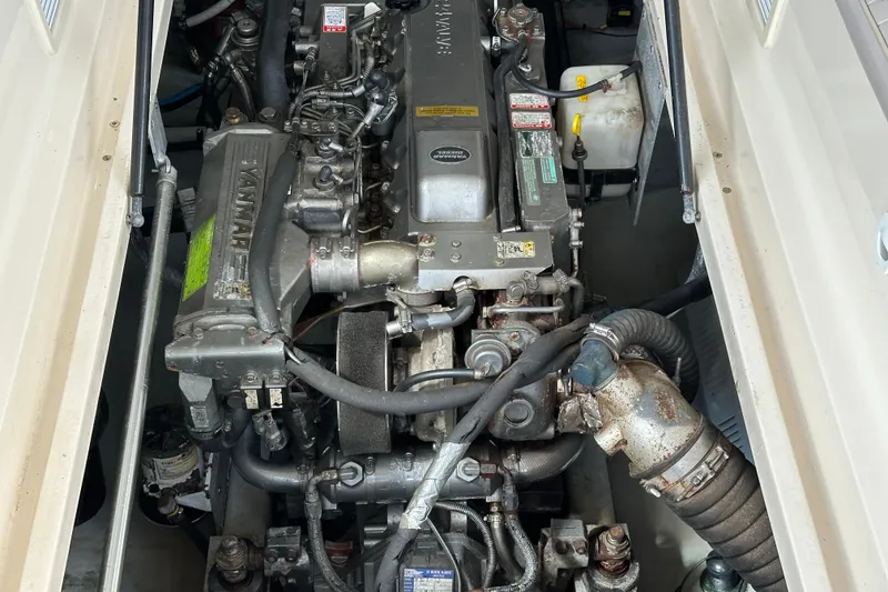 Slide: The Image of Engine compartment of a 2004 Mainship Pilot 30 boat, featuring a Yanmar engine. - 19